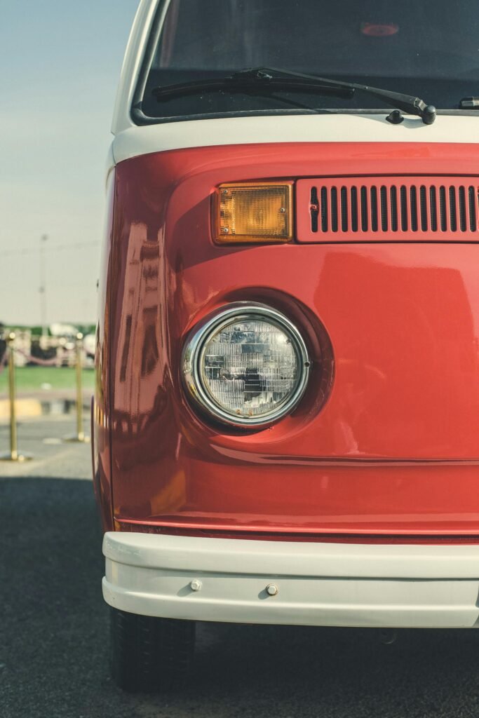 Close-up of a classic red Volkswagen van front view in Sharjah, UAE.